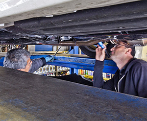 Mechanic inspecting a vehicle